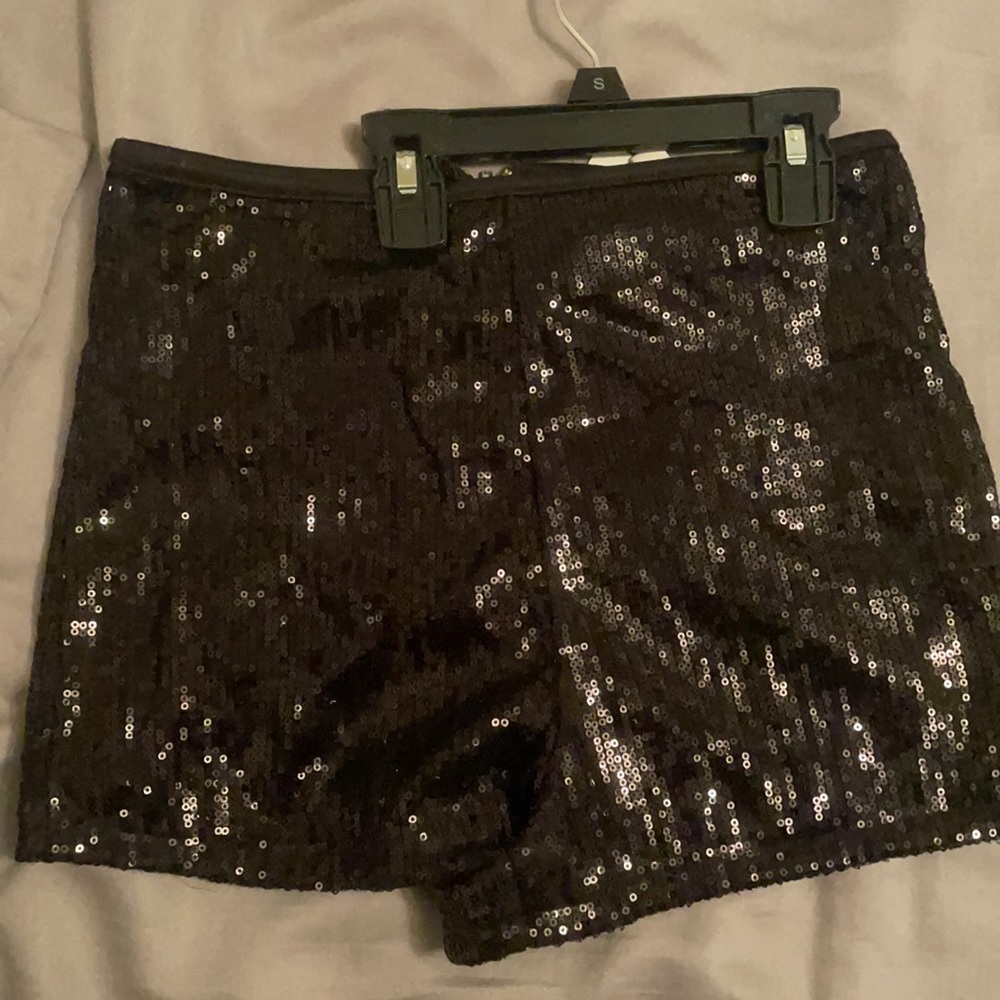 Black shiny shorts size small, never worn. New w/tags